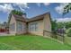 Exterior of a home with a well-manicured lawn, garden, and brick patio with steps at 1065 Chippewa Oak Dr, Dacula, GA 30019