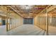 Spacious unfinished basement with exposed beams and concrete flooring awaiting customization at 1065 Chippewa Oak Dr, Dacula, GA 30019