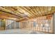 Unfinished basement featuring exposed insulation, beams, and concrete, ready for personalized design at 1065 Chippewa Oak Dr, Dacula, GA 30019