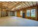 Unfinished basement with windows, offering potential for customization and expansion at 1065 Chippewa Oak Dr, Dacula, GA 30019