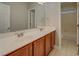 Bathroom featuring a double vanity, large mirror, and a bath tub at 1065 Chippewa Oak Dr, Dacula, GA 30019