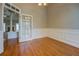 Dining Room with hardwood floors, view to the living area, and French doors at 1065 Chippewa Oak Dr, Dacula, GA 30019