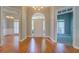 Spacious foyer with gleaming hardwood floors and open views to the dining and living areas, perfect for entertaining at 1065 Chippewa Oak Dr, Dacula, GA 30019
