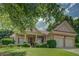 Beautiful home showcasing manicured landscaping, lush greenery, and a spacious front yard at 1065 Chippewa Oak Dr, Dacula, GA 30019