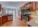 Open-concept kitchen with stainless appliances, hardwood floors, and dining area at 1065 Chippewa Oak Dr, Dacula, GA 30019