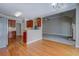Kitchenette area features hardwood flooring and opens to a living area with fireplace at 1065 Chippewa Oak Dr, Dacula, GA 30019
