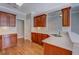 Kitchenette area features hardwood flooring, stainless appliances, and light countertops at 1065 Chippewa Oak Dr, Dacula, GA 30019