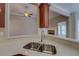 Kitchenette area features light countertops and opens to a living area with fireplace at 1065 Chippewa Oak Dr, Dacula, GA 30019