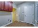 Practical laundry room with cabinets and access to other rooms at 1065 Chippewa Oak Dr, Dacula, GA 30019