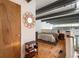Cozy bedroom loft with hardwood floors, exposed beams, and ample natural light at 1661 La France Ne St # 222, Atlanta, GA 30307