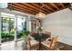 Bright dining area with a modern table, stylish chairs, and sliding glass doors at 1661 La France Ne St # 222, Atlanta, GA 30307