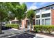 Exterior view of brick townhouse with landscaping and parking at 1661 La France Ne St # 222, Atlanta, GA 30307