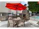 Community grill area with stone fireplace, outdoor seating, and stainless steel grills at 1661 La France Ne St # 222, Atlanta, GA 30307