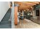 Spacious kitchen featuring stainless steel appliances, island, stairs and views of the combined living space at 1661 La France Ne St # 222, Atlanta, GA 30307