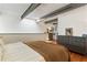 Bright main bedroom featuring industrial-style ceiling and large skylight at 1661 La France Ne St # 222, Atlanta, GA 30307