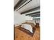 Comfortable and bright main bedroom with wood floors, neutral tones, and a relaxing ambiance at 1661 La France Ne St # 222, Atlanta, GA 30307