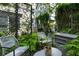 Inviting backyard patio with lush greenery, stylish seating, and privacy fencing at 1661 La France Ne St # 222, Atlanta, GA 30307