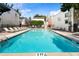 Sparkling pool with lounge chairs around and blue sky above creates a relaxing community space at 1661 La France Ne St # 222, Atlanta, GA 30307