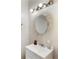 Simple bathroom with large decorative mirror and standard vanity at 1841 Mobley St, Austell, GA 30106