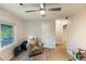 Bedroom with window, hardwood-style flooring, neutral paint and a ceiling fan at 1841 Mobley St, Austell, GA 30106