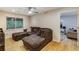 Comfortable living room with modern ceiling fan, hardwood floors, and neutral paint at 1841 Mobley St, Austell, GA 30106