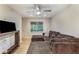 Inviting living room with contemporary lighting, hardwood floors and a cozy sectional couch at 1841 Mobley St, Austell, GA 30106
