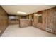 Partially finished basement with a bar and wood paneled walls at 3332 Clay Rd, Austell, GA 30106