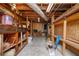 Unfinished basement area with wooden shelves to maximize storage at 3332 Clay Rd, Austell, GA 30106