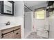 Updated bathroom featuring a sink with a cabinet, shower, and a commode at 3332 Clay Rd, Austell, GA 30106
