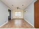 Bright dining room with tile floors, light gray walls, and a window with light filtering blinds at 3332 Clay Rd, Austell, GA 30106