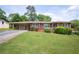 Charming single-story brick home with a covered carport and a well-maintained front yard with mature landscaping at 3332 Clay Rd, Austell, GA 30106