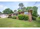This charming single-story brick home features mature landscaping and an expansive, well-maintained lawn at 3332 Clay Rd, Austell, GA 30106