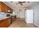 Functional kitchen with wood cabinets, gray walls, appliances, and tile floors at 3332 Clay Rd, Austell, GA 30106