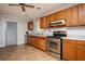 Eat-in kitchen featuring stainless steel appliances, laminate countertops, and wood cabinets at 3332 Clay Rd, Austell, GA 30106