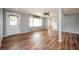 Bright living room featuring laminate wood floors, gray walls and natural light from a front door and large window at 3332 Clay Rd, Austell, GA 30106