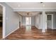 Spacious living room with hardwood floors, neutral paint, and a view to the kitchen at 3332 Clay Rd, Austell, GA 30106