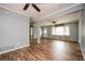 Inviting living room featuring hardwood floors, neutral walls and updated ceiling fans at 3332 Clay Rd, Austell, GA 30106