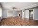 Open-concept living room boasts hard wood floors, natural light and access to bathroom at 3332 Clay Rd, Austell, GA 30106