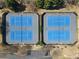 Aerial view of four well-maintained tennis courts with parking, perfect for a recreational community at 7335 Treyland Ct, Cumming, GA 30041
