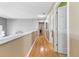 Hallway with hardwood floors and neutral paint at 7335 Treyland Ct, Cumming, GA 30041