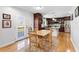Eat-in kitchen features granite counters, stainless appliances, and seamless access to the outdoor deck at 7335 Treyland Ct, Cumming, GA 30041