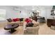 Spacious living room with tile floors, large sectional sofa, and wet bar area at 7335 Treyland Ct, Cumming, GA 30041