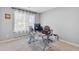 Bright home office featuring carpet, gray walls, and a metal and glass desk with computer at 7335 Treyland Ct, Cumming, GA 30041