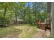 Spacious backyard with a wooden deck and plenty of green space at 110 Windsor Chase Dr, Lawrenceville, GA 30043