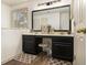 Bathroom vanity with a large mirror, drawers, and cabinets, with stylish decor and rugs at 110 Windsor Chase Dr, Lawrenceville, GA 30043
