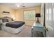 Cozy bedroom with a comfortable bed, window with shutters, and stylish furnishings at 110 Windsor Chase Dr, Lawrenceville, GA 30043