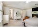 Bedroom featuring a fireplace, shuttered windows and neutral colored decor at 110 Windsor Chase Dr, Lawrenceville, GA 30043