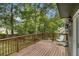 Spacious wooden deck overlooking lush greenery and mature trees at 110 Windsor Chase Dr, Lawrenceville, GA 30043