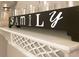 Shelf with decor and glassware and decorative cutout details at 110 Windsor Chase Dr, Lawrenceville, GA 30043