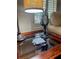 Lamp on end table with coasters on a glass top surface at 110 Windsor Chase Dr, Lawrenceville, GA 30043